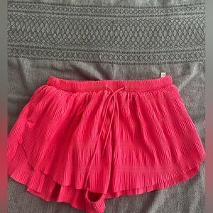 Large free people movement pink shirts textured.